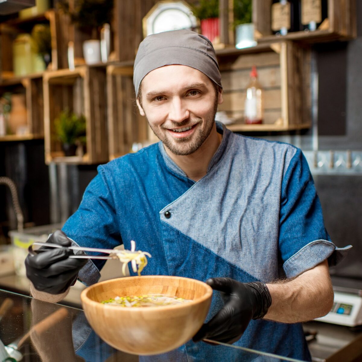 Chief cook at the asian restaurant kitchen